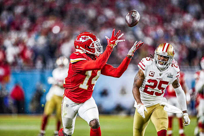 The Chiefs' Sammy Watkins catches a pass over the 49ers' Richard Sherman in Super Bowl LIV